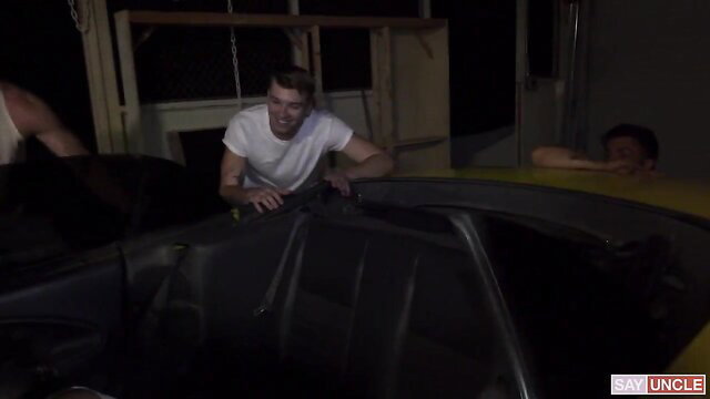 Three hot guys helping with car in steamy Pig Bottoms threesome