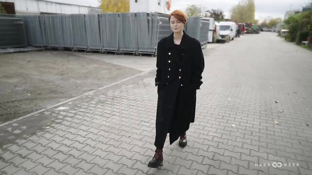 Redhead in black coat struts outdoors, HardWerk Ask Me Bang Neen