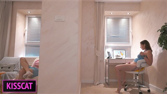 Hot stepmom in lingerie sits on desk chair, teases stepson in bed