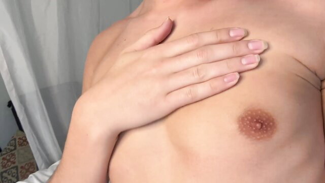 Cole Bentley femboy strips, hand on chest showing nipple closeup