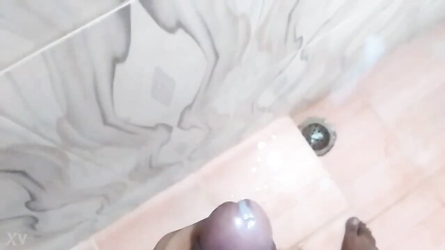 Amateur POV handjob closeup of throbbing cock on wet bathroom tiles