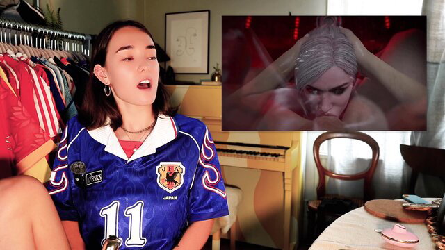 Brunette in Japan soccer jersey reacts to busty silver-haired gamer's intense Baldur's Gate orgasm