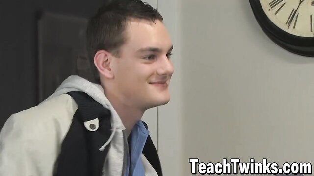 Smirking young white twink in hoodie smiles sideways in sex ed scene