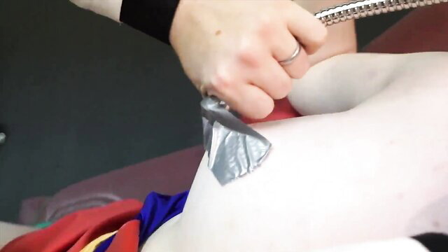 Woman taped anus enema hose insertion closeup BDSM kink