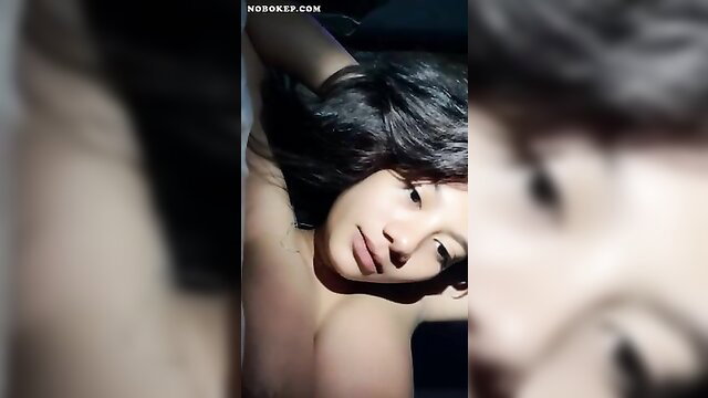 Beautiful Indonesian Dinda topless selfie, long dark hair, seductive pose
