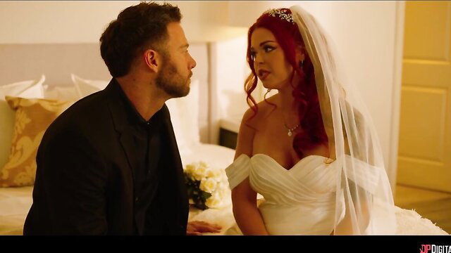 Gorgeous redhead bride in wedding dress with groom on bed