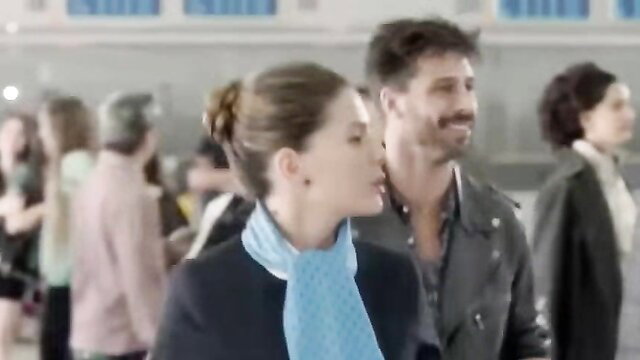 La China Suarez in El Hilo Rojo - elegant brunette in blue scarf with handsome man
