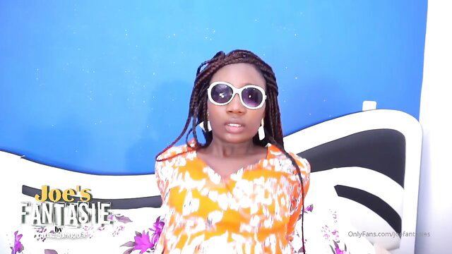 Braided African beauty in orange dress on Joe's Fantasy OnlyFans