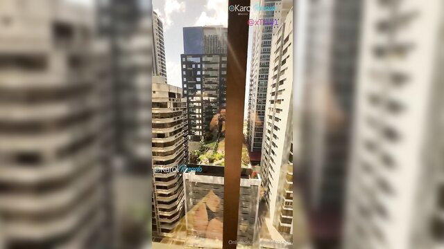 Blurry city skyline view from high-rise window, adult video thumbnail