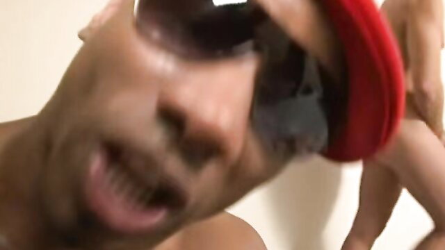 French Beurette Arab woman in red cap with black man closeup face