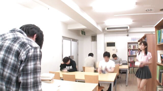 Japanese schoolgirl in miniskirt at library study table with guys