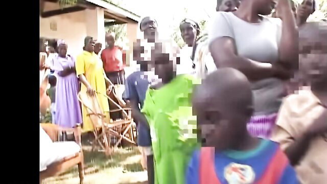 African village women and kids in colorful dresses outdoor gathering