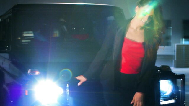 Alecia Fox unzips blazer by car, teasing red top and curves