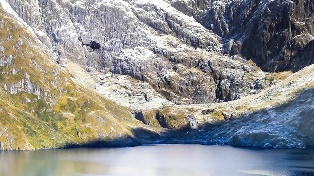 Helicopter over snowy mountains and lake in Mission Impossible Fallout parody