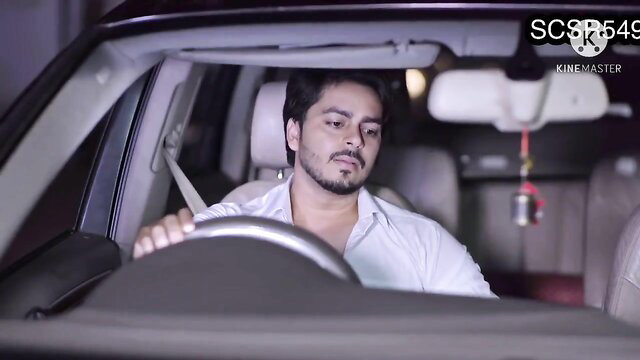 Handsome Desi man driving car in tense nighttime scene