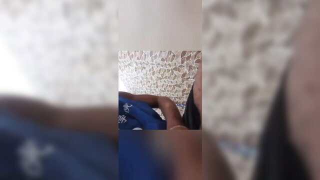 Young Congolese woman in blue top from Kinshasa teases in amateur closeup