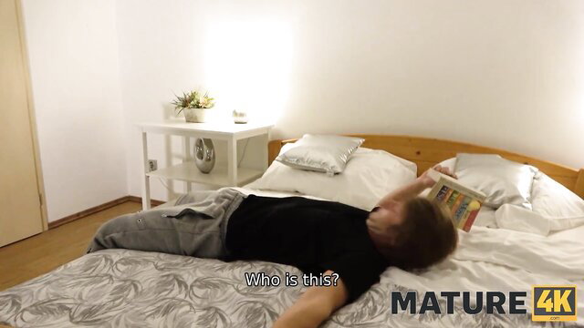 Mature brunette man lying on bed in Mature4K adult video thumbnail