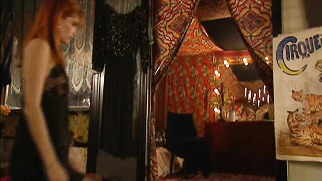 Laure Sainclair in sexy black lingerie at circus tent in Illusions 1998