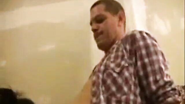 Muscular white man in plaid shirt smirking in closeup adult video thumbnail