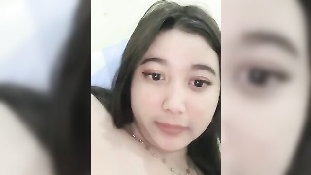 Cute Indonesian webcam girl closeup selfie with necklace