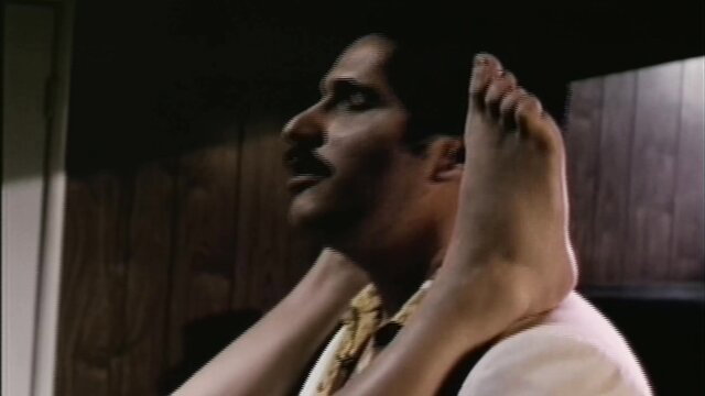 Indian man in suit with bare feet soles up closeup in If My Mother Only Knew