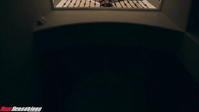 Emma Marx bound in stocks submitting in dark BDSM dungeon