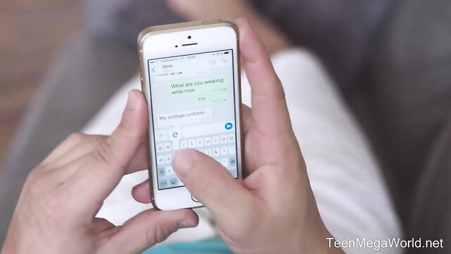 Teen girl texts step-brother-in-law on iPhone, bare feet visible