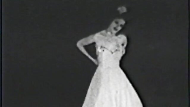 Vintage retro nude woman in sexy lace dress posing seductively