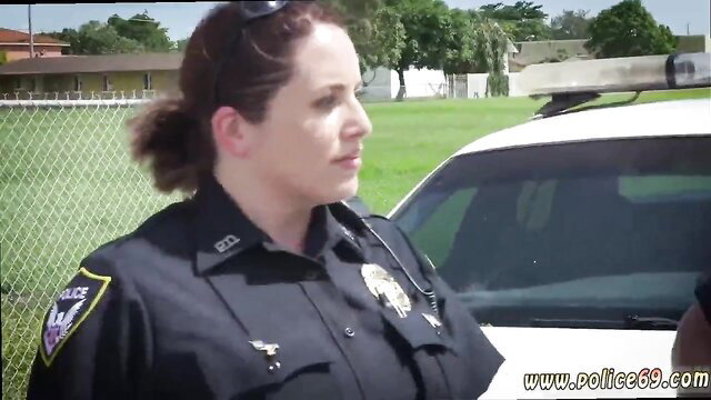 Redhead police milf in uniform by patrol car at golf course
