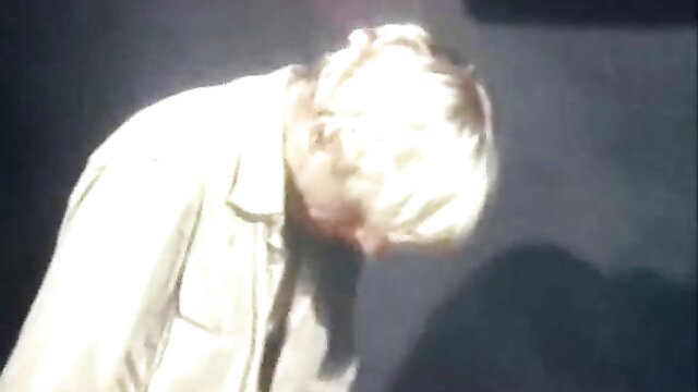 Blonde man in white coat bending over in vintage gay porn thumbnail