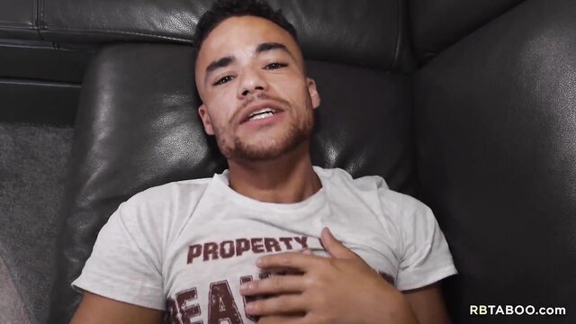 Beaux Banks in tight PROPERTY OF BEAR t-shirt lounging seductively