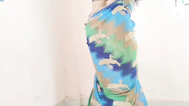 Desisarika in colorful saree, hot Indian wifey side pose