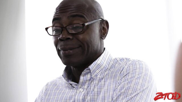 Bald Black man in glasses smirks in hardcore interracial thumbnail