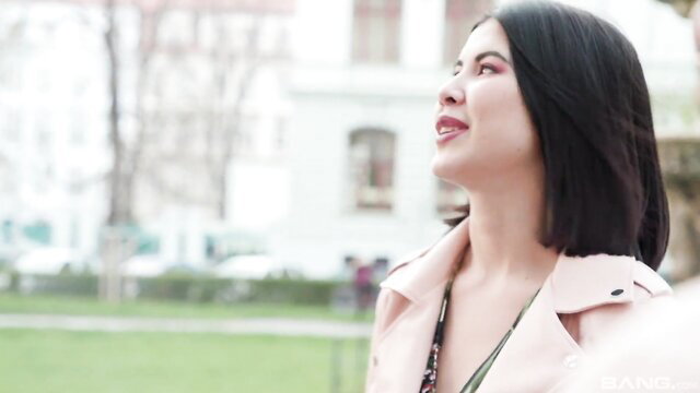 Cindy Shine looking up seductively in pink coat, slender teen tease