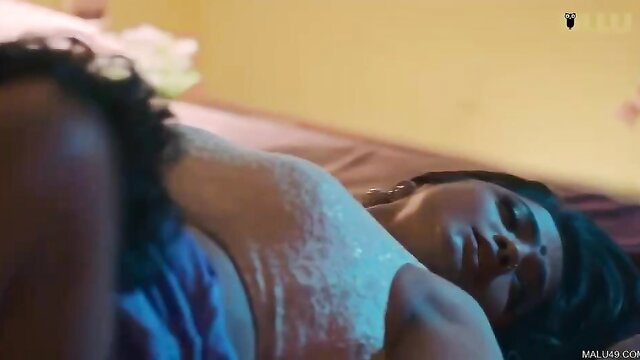 Indian woman in sheer lingerie lying nude on bed in Ullu web series