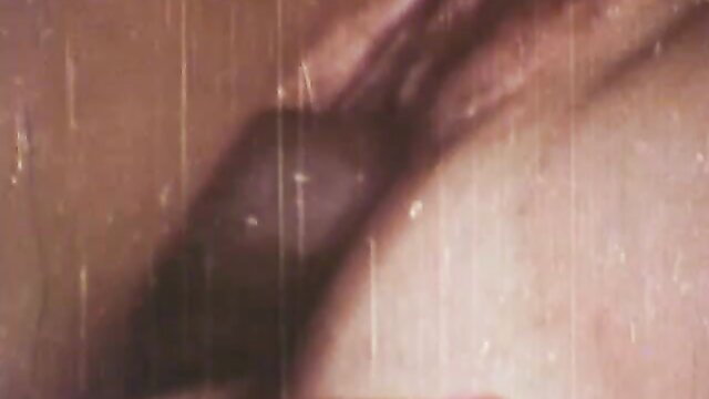 Retro O.Z. Films closeup of woman's wet pussy lips and clit