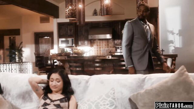 Avery Black lounging on couch as boss looms behind ready to fuck