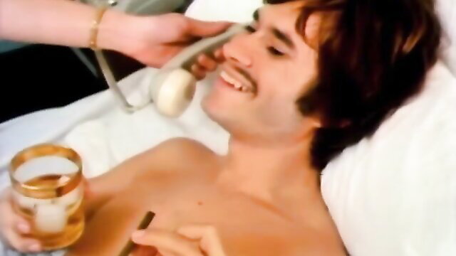 Vintage 70s guy nude in bed on phone with drink, Tabu Film