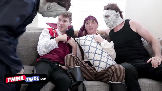 Twink Trade stepdads in vampire pirate Jason costumes hug teen on couch