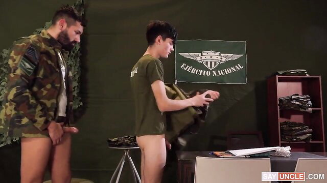 Two hot Latino soldiers nude in barracks, one stroking cock near recruit