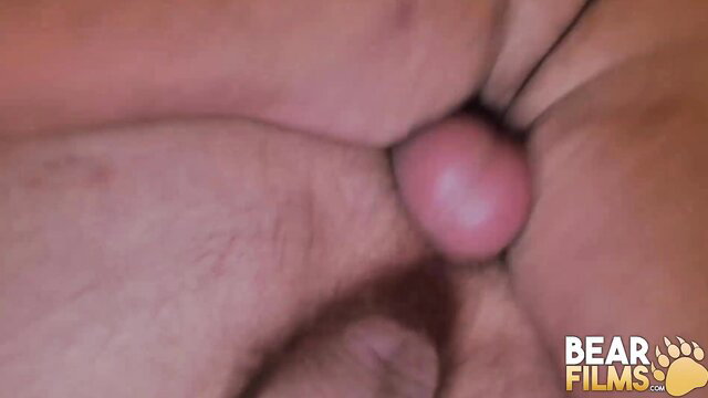 Closeup of hard cock nestled between pale trans woman's ass cheeks at night