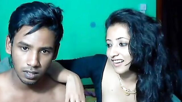Desi Indian couple leaked cam session, topless girl with guy arm around