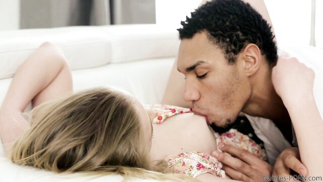 Milana Fox irresistible blonde passionately kissed by black guy on couch