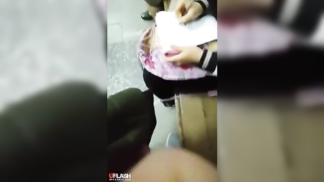Amateur POV cock flash to seated Asian woman in pink skirt reading paper