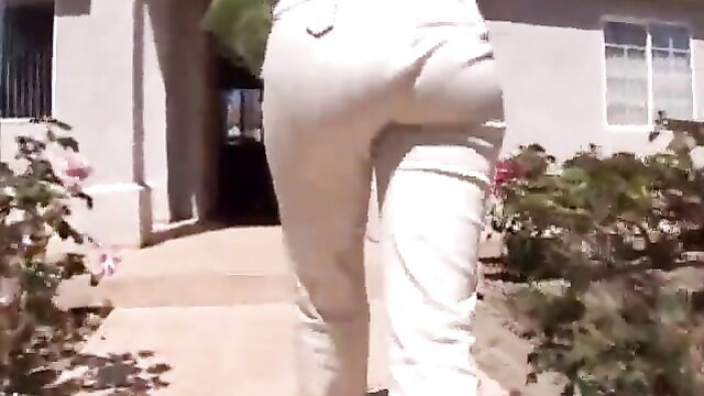 Mika Tan big ass in tight white pants walking outdoors