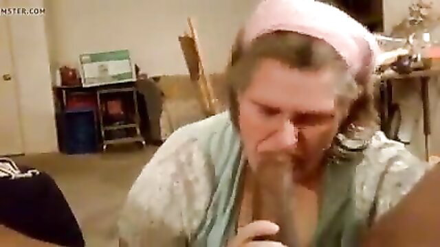 Granny in headscarf sucking huge black cock closeup