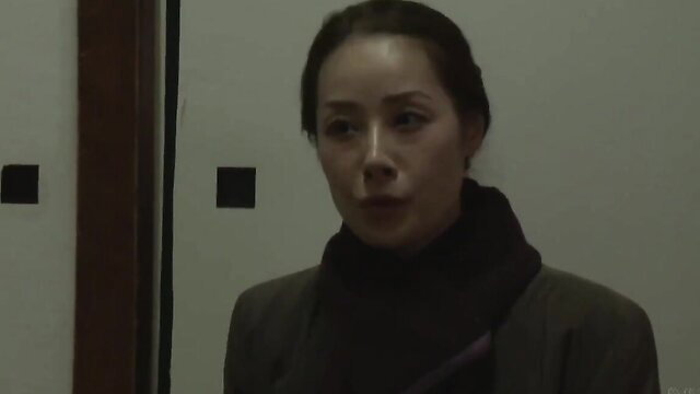 Asian MILF in turtleneck and suit closeup, seductive gaze