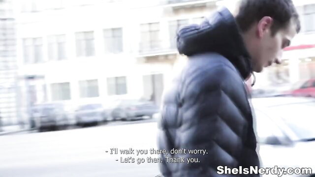 Fit guy in puffy jacket walking urban street on sightseeing trip