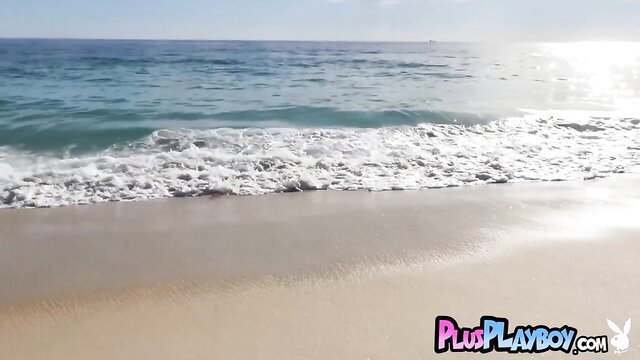 Stunning lifeguard babe posing sexy on sunny beach