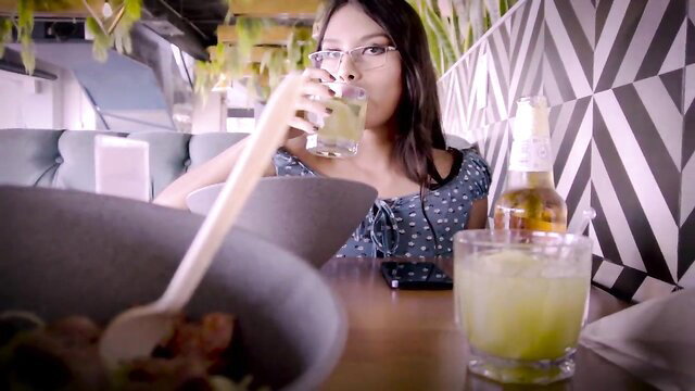Sammy Corazon sipping lime drink in off-shoulder top POV bar scene